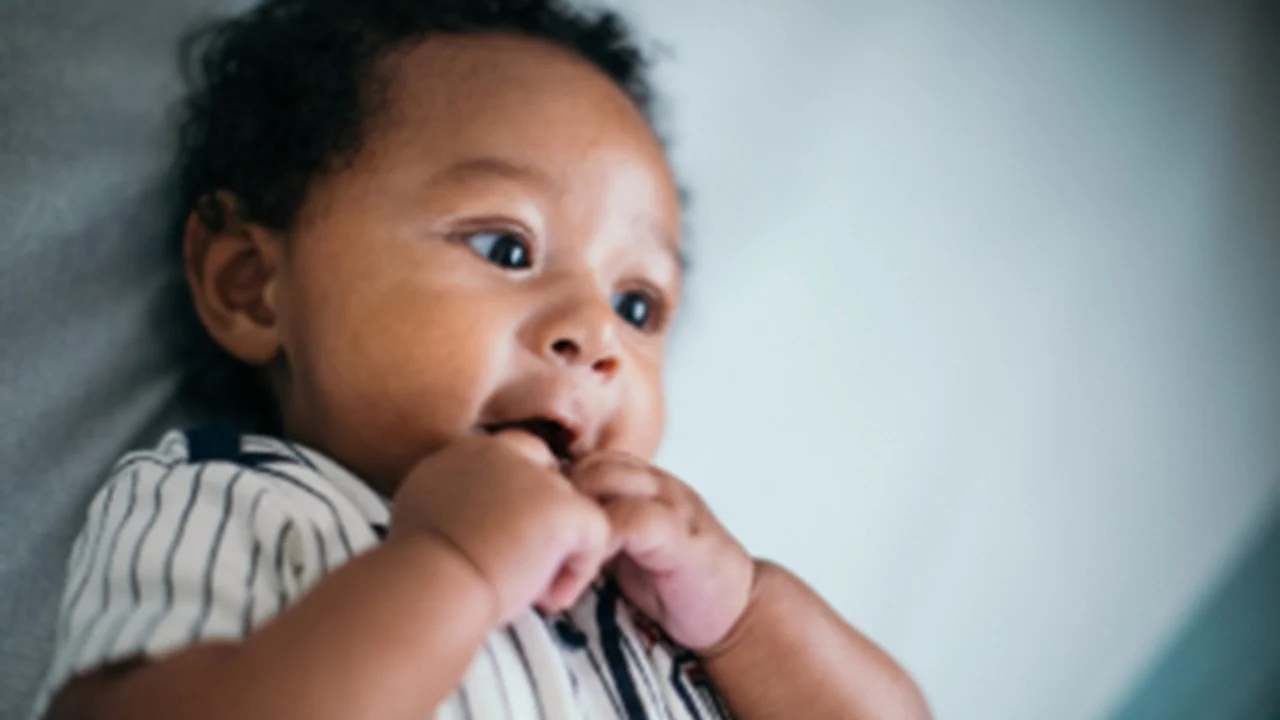 infant wearing striped shirt