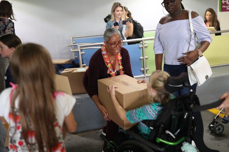 Children volunteering to drop off packages