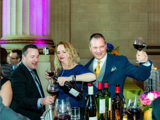 A Vintage Affair 2020 event attendees enjoy sampling various wines.