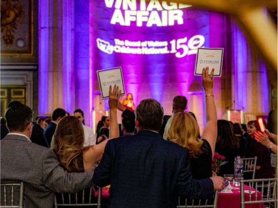 A Vintage Affair 2020 event attendees participate in the silent auction.