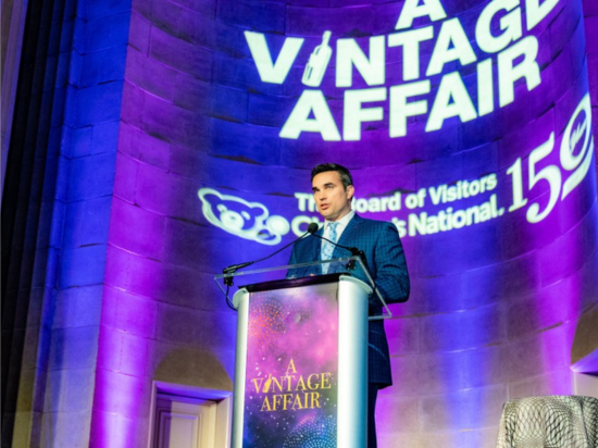 A guest speaker addresses guests from a podium during the A Vintage Affair 2020 event at the Mellon Auditorium in Washington, D.C.