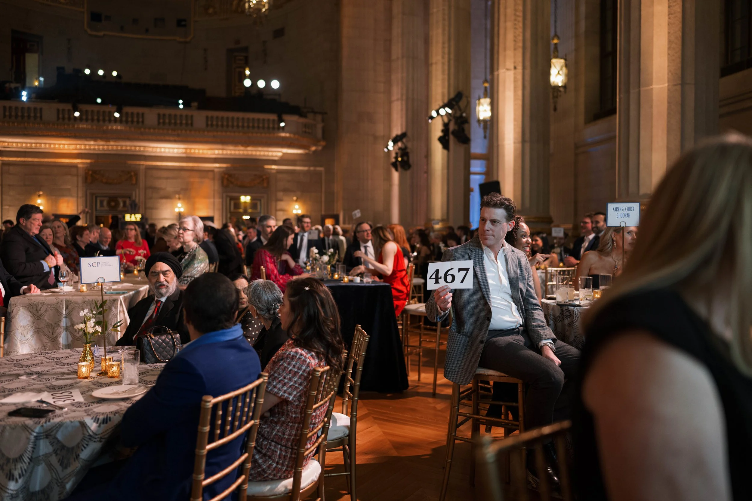 A Vintage Affair 2025 event attendees participate in the silent auction.