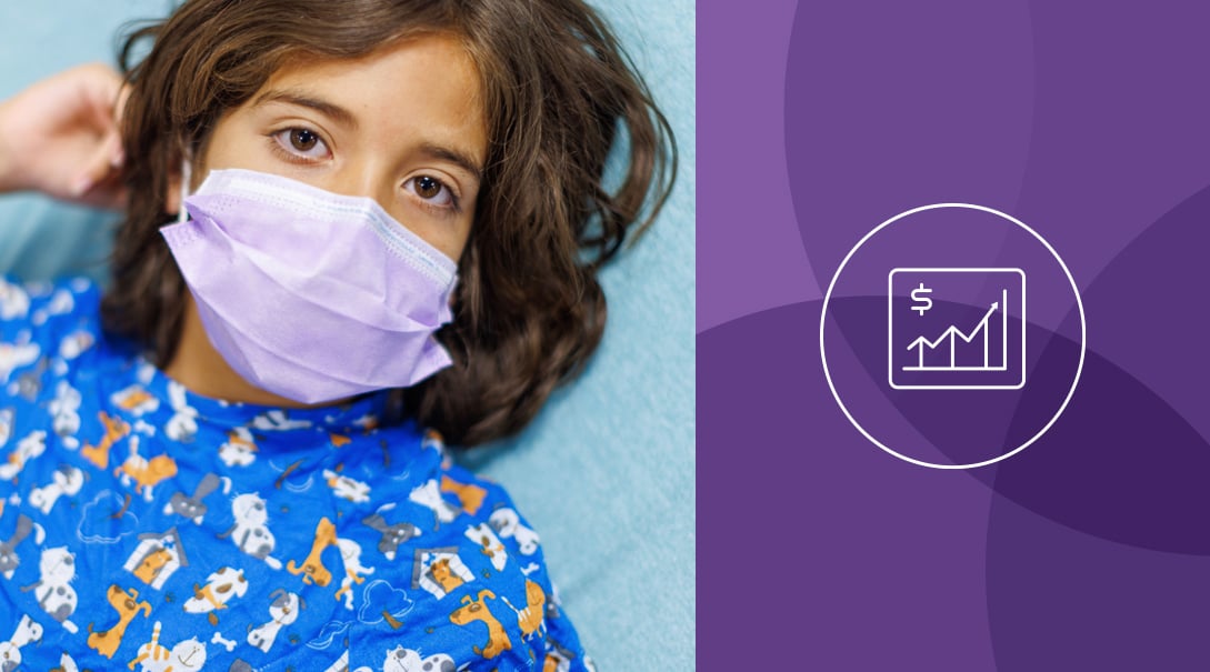 An elementary school aged child wearing a surgical mask.