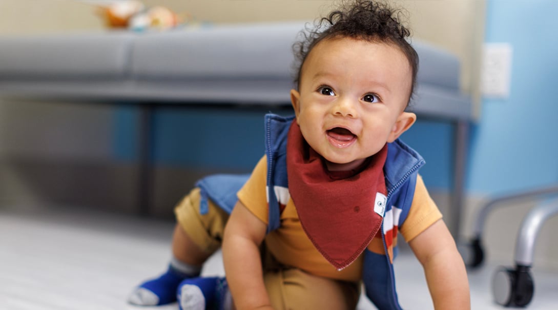 A one-year-old male patient smiles during a check-up appointment at Children's National.