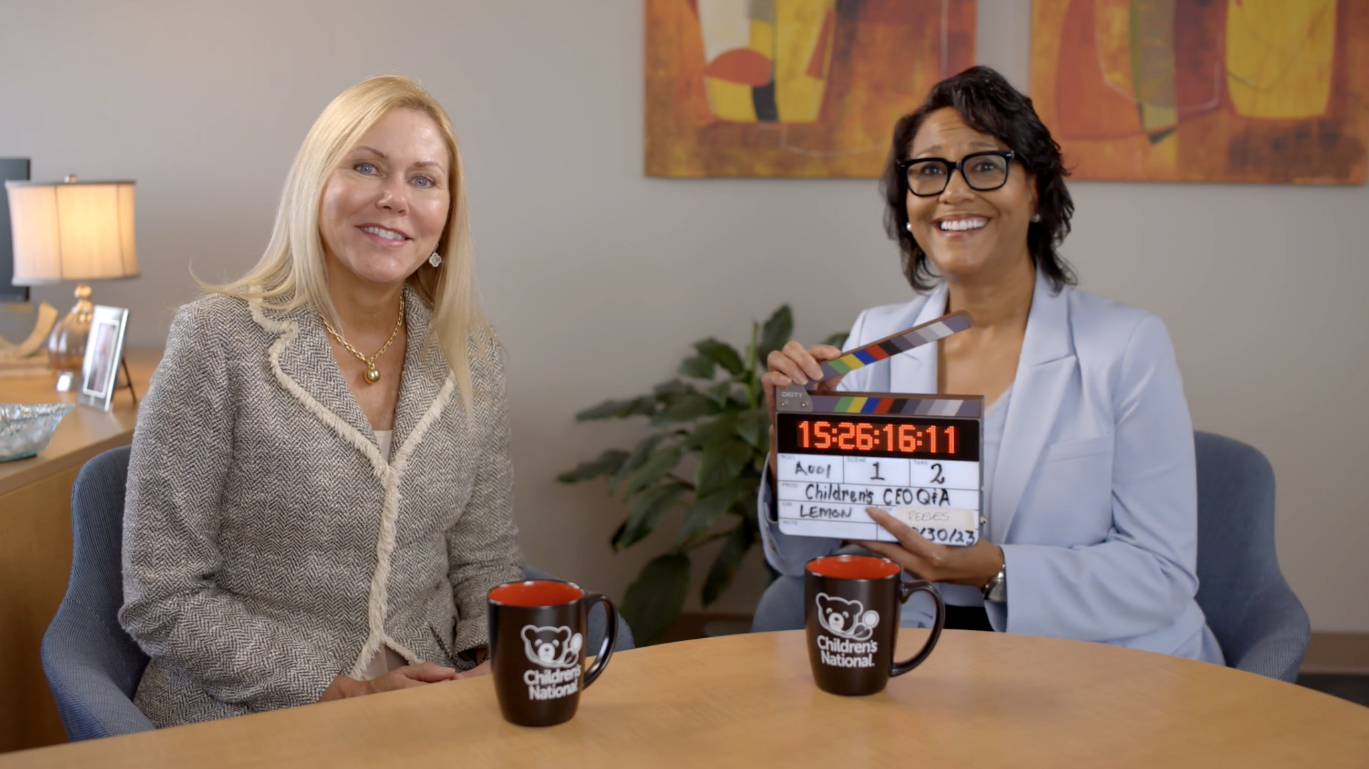 DeAnn Marshall and Michelle Riley-Brown pose for a photo during an interview.