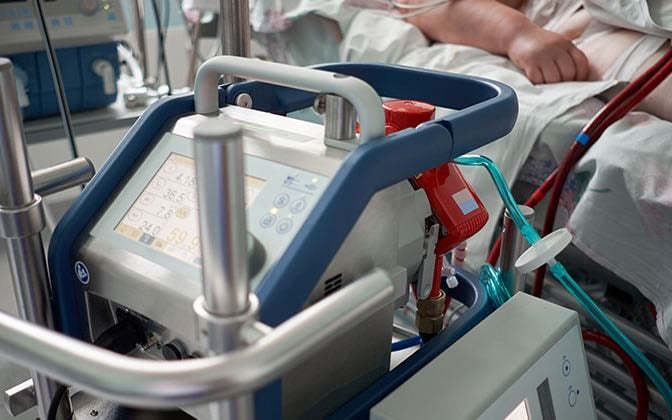 Extracorporeal Membrane Oxygenation machine performs heart and lung bypass for a newborn in need.