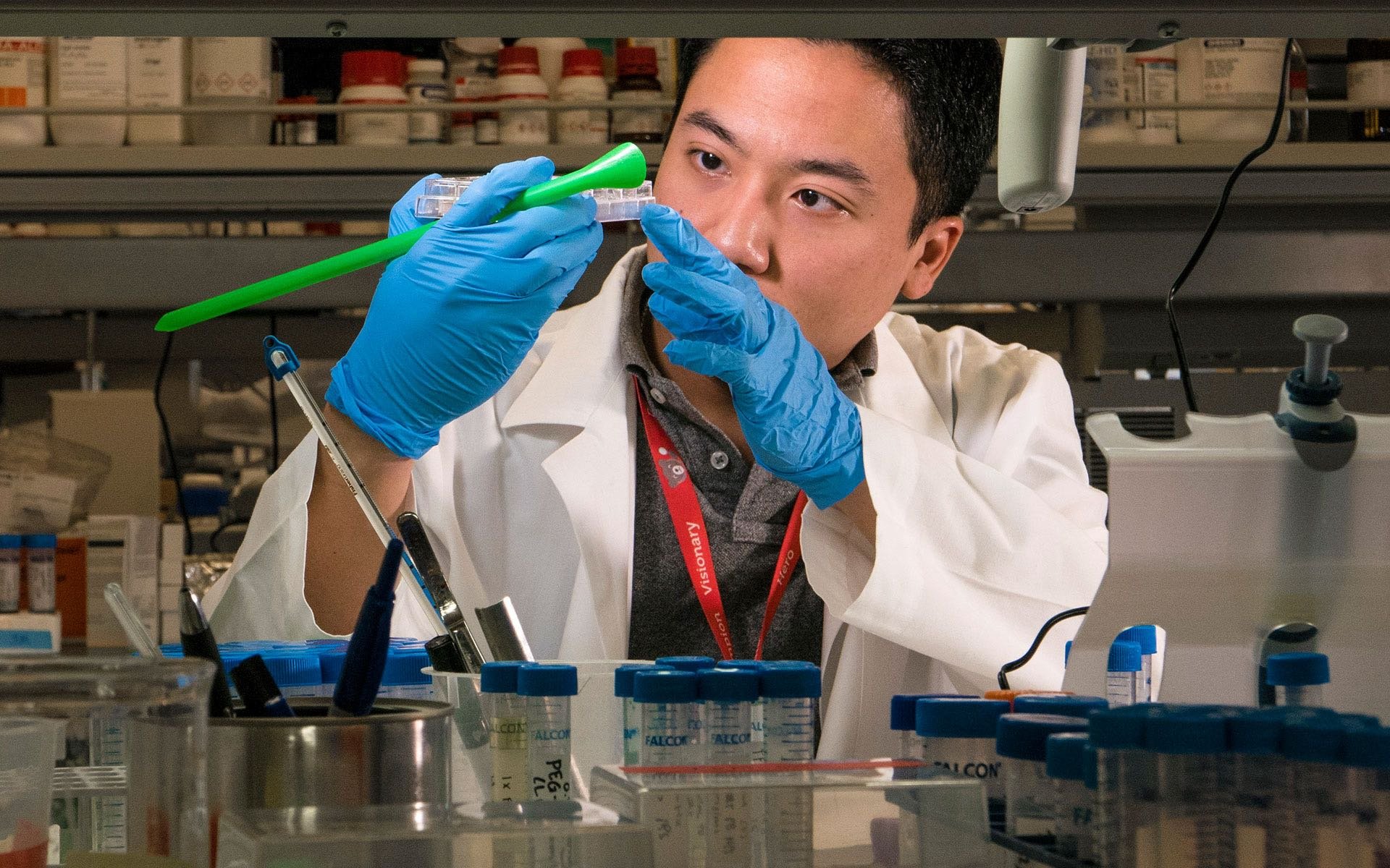 A researcher conducts an experiment in the lab.