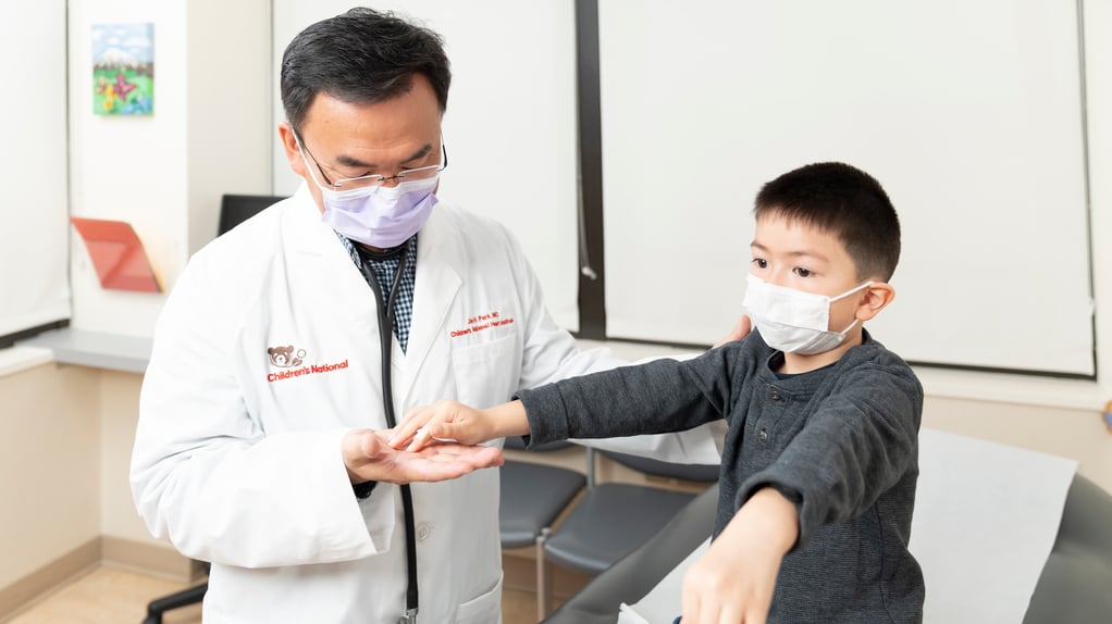 Dr. Park examines young child