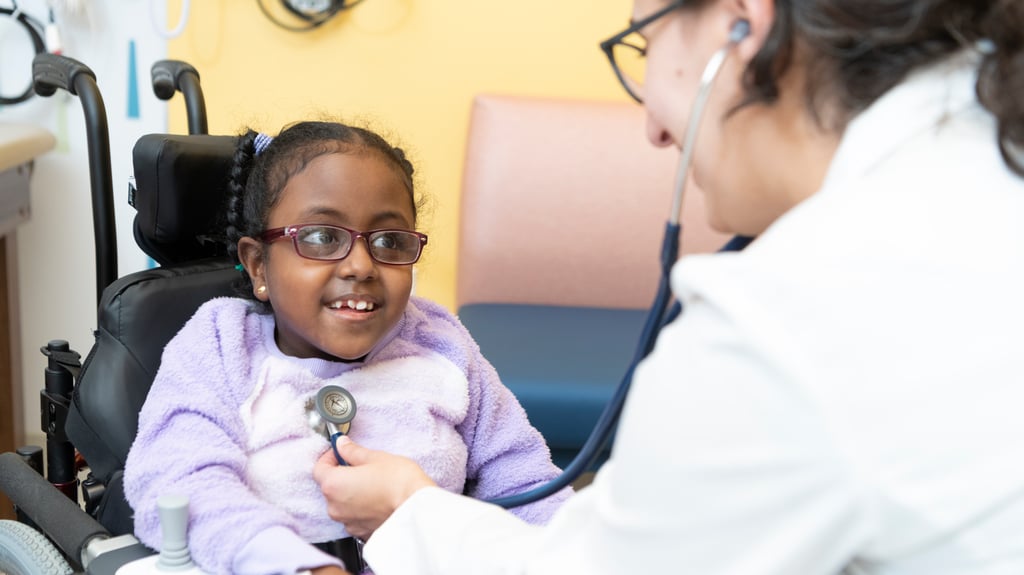 doctor listens to child's heart