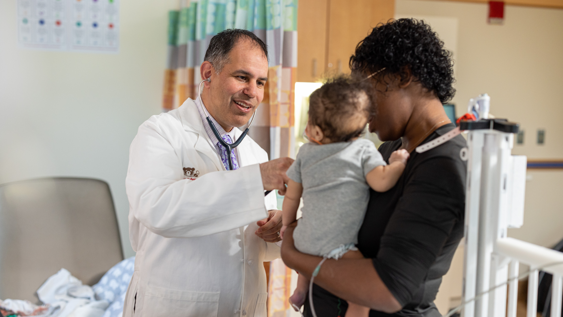 doctor with baby and mother