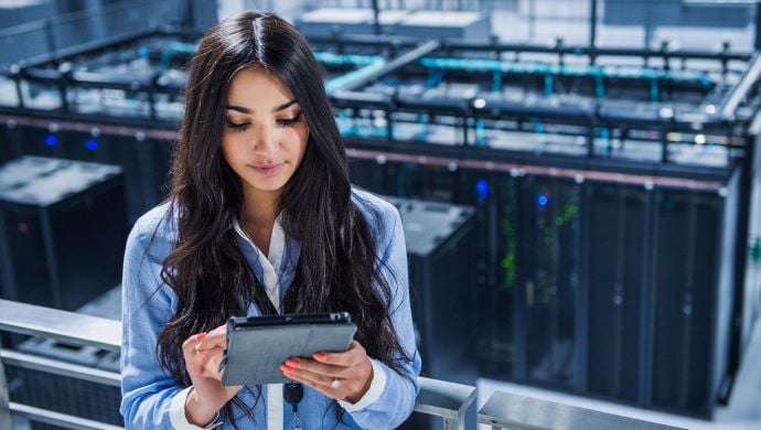 Woman on tablet in data centre Woman on tablet in data centre