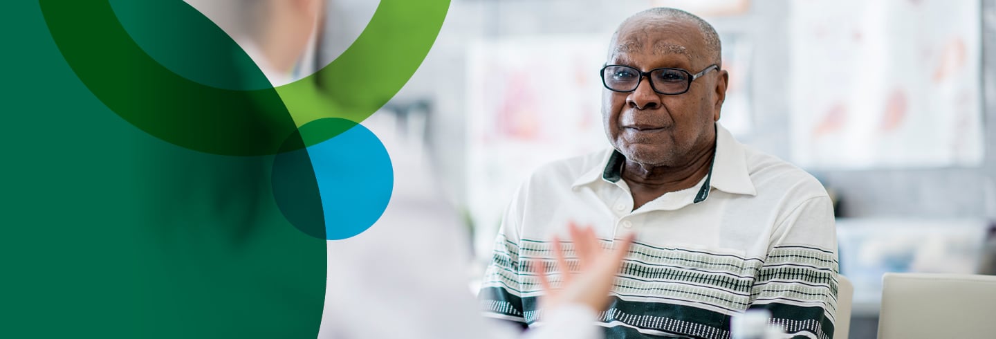 male patient talking with physician