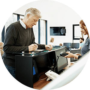 Customer making a co-pay at the front desk