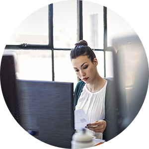 Woman looks at healthcare invoice