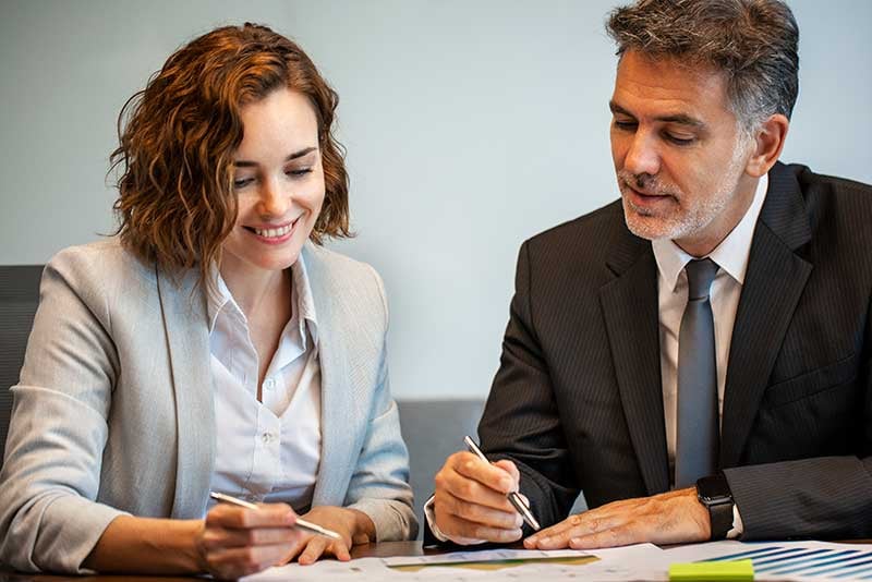 A man and a woman in a meeting.
