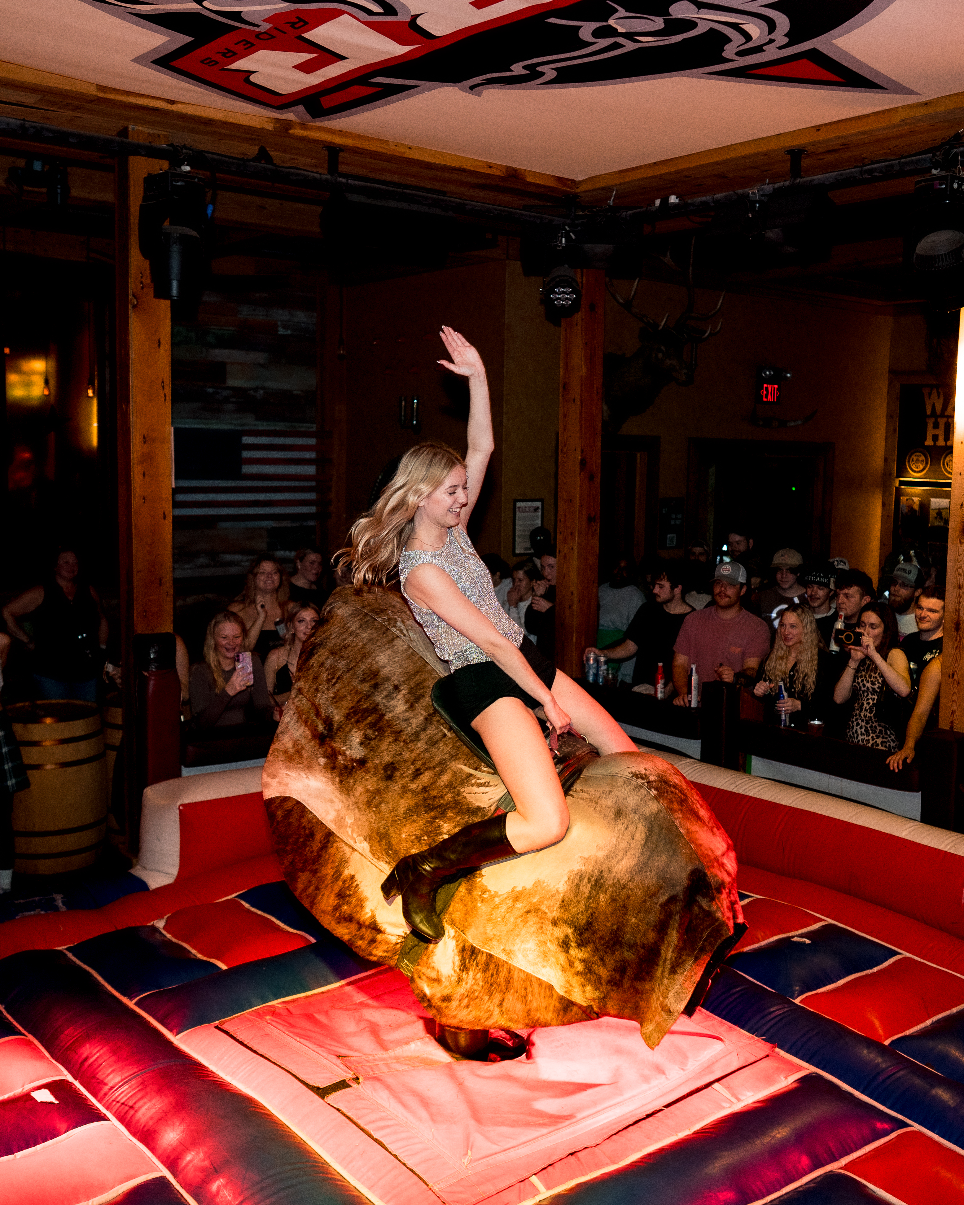 Customer Riding on Bull 