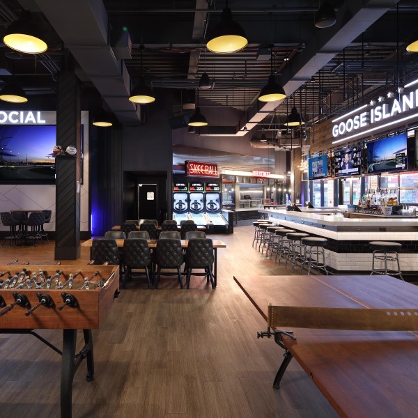 Social bar and games in Sports & Social St. Louis, featuring arcade games, ski ball, foosball, and more.