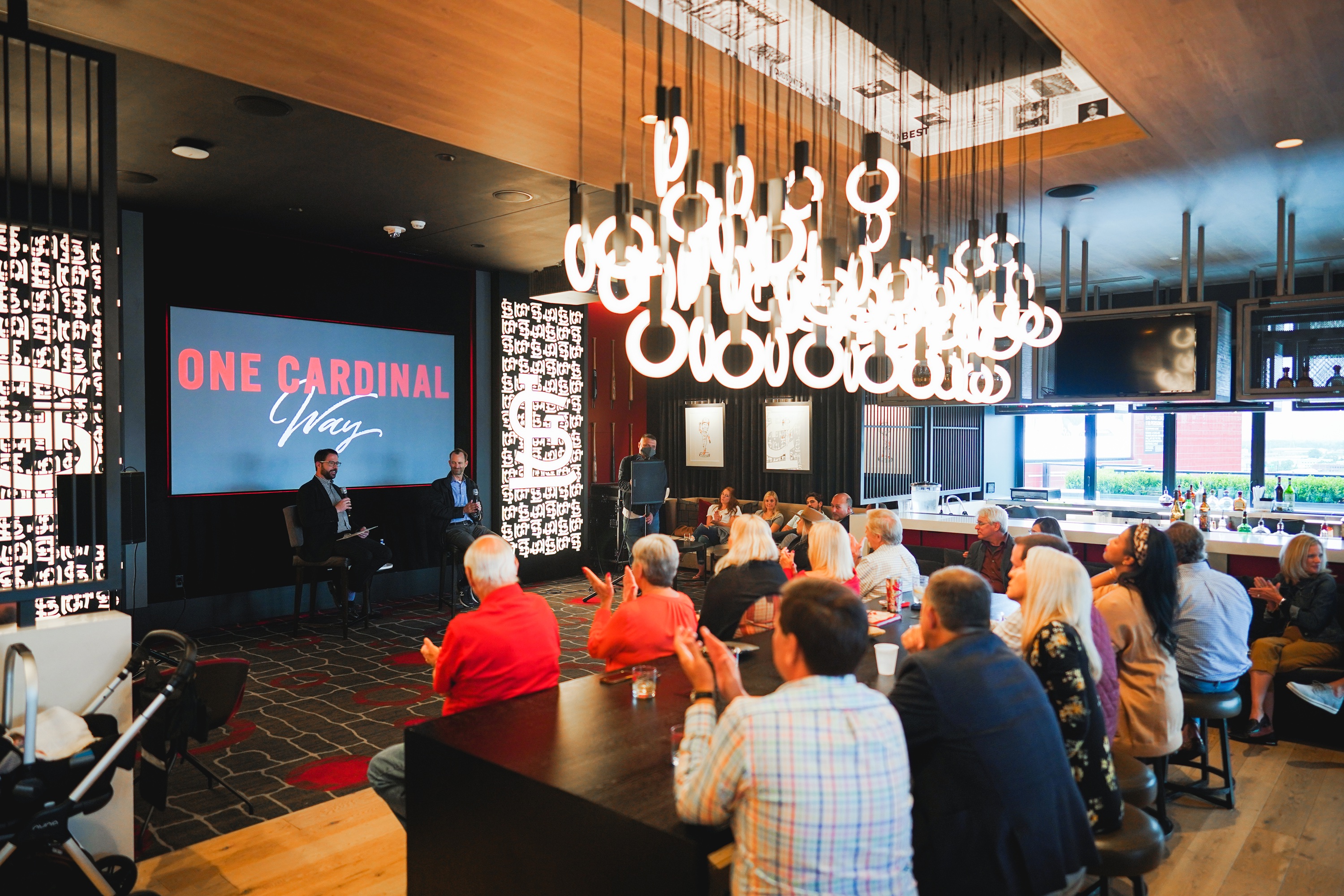 Resident giving a presentation at One Cardinal Way