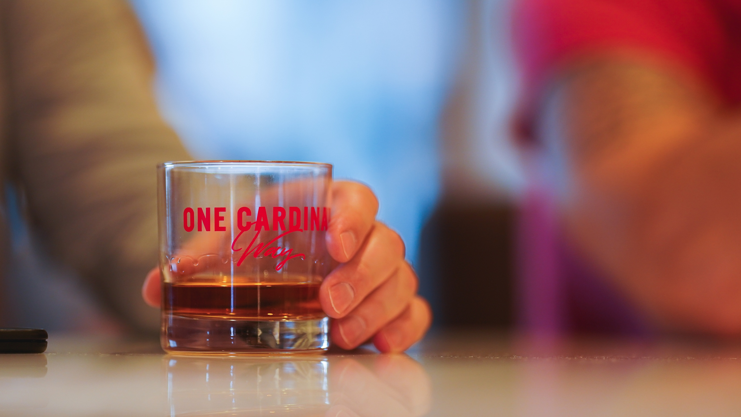 Bourbon glass with One Cardinal Way logo