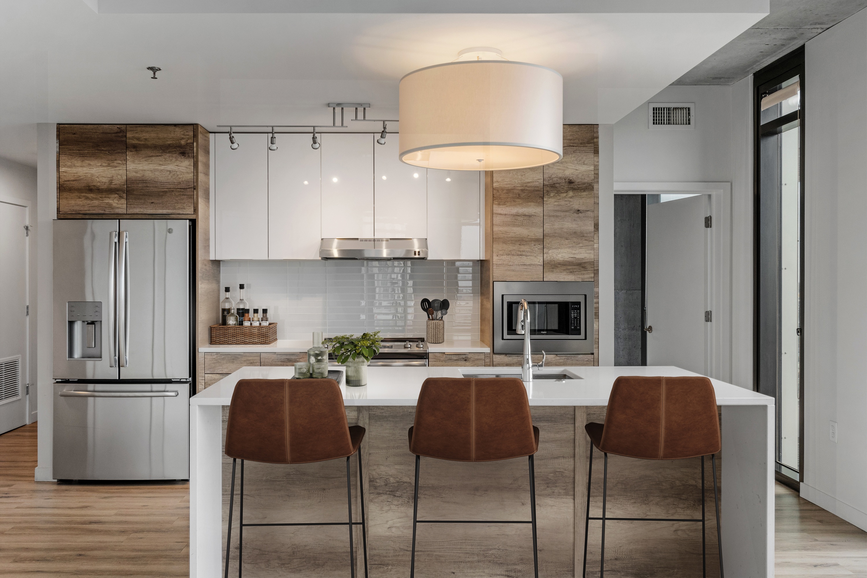 Modern apartment kitchen with island at One Cardinal Way