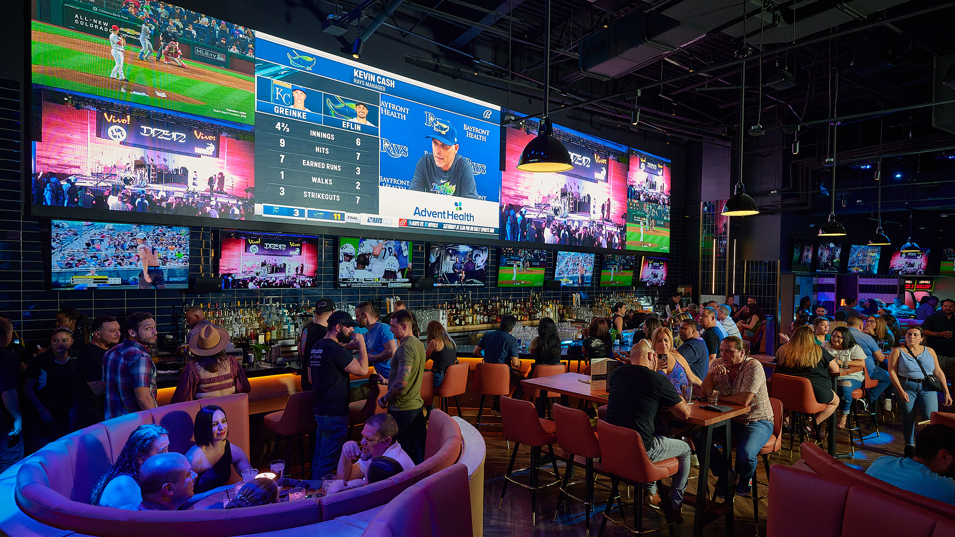 Big screen at Sports and Social Miami with baseball game playing.