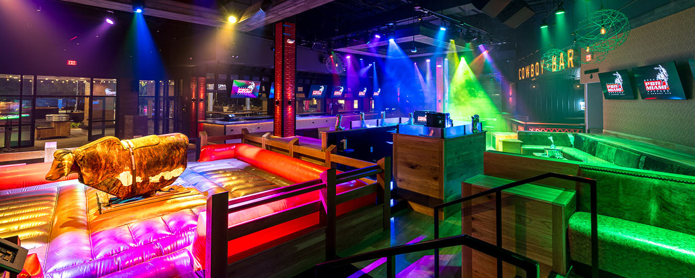 Architectural shot of PBR Miami covered in strobe lights.