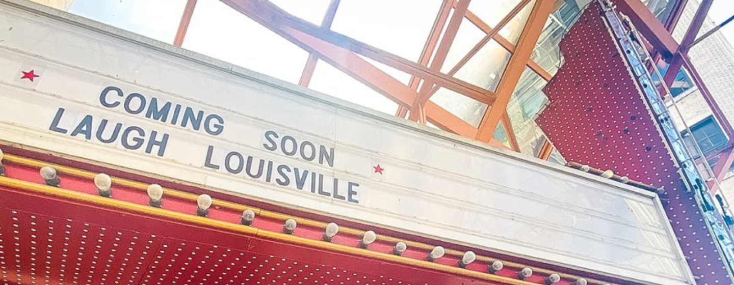 Sign saying "Coming Soon- Laugh Louisville"