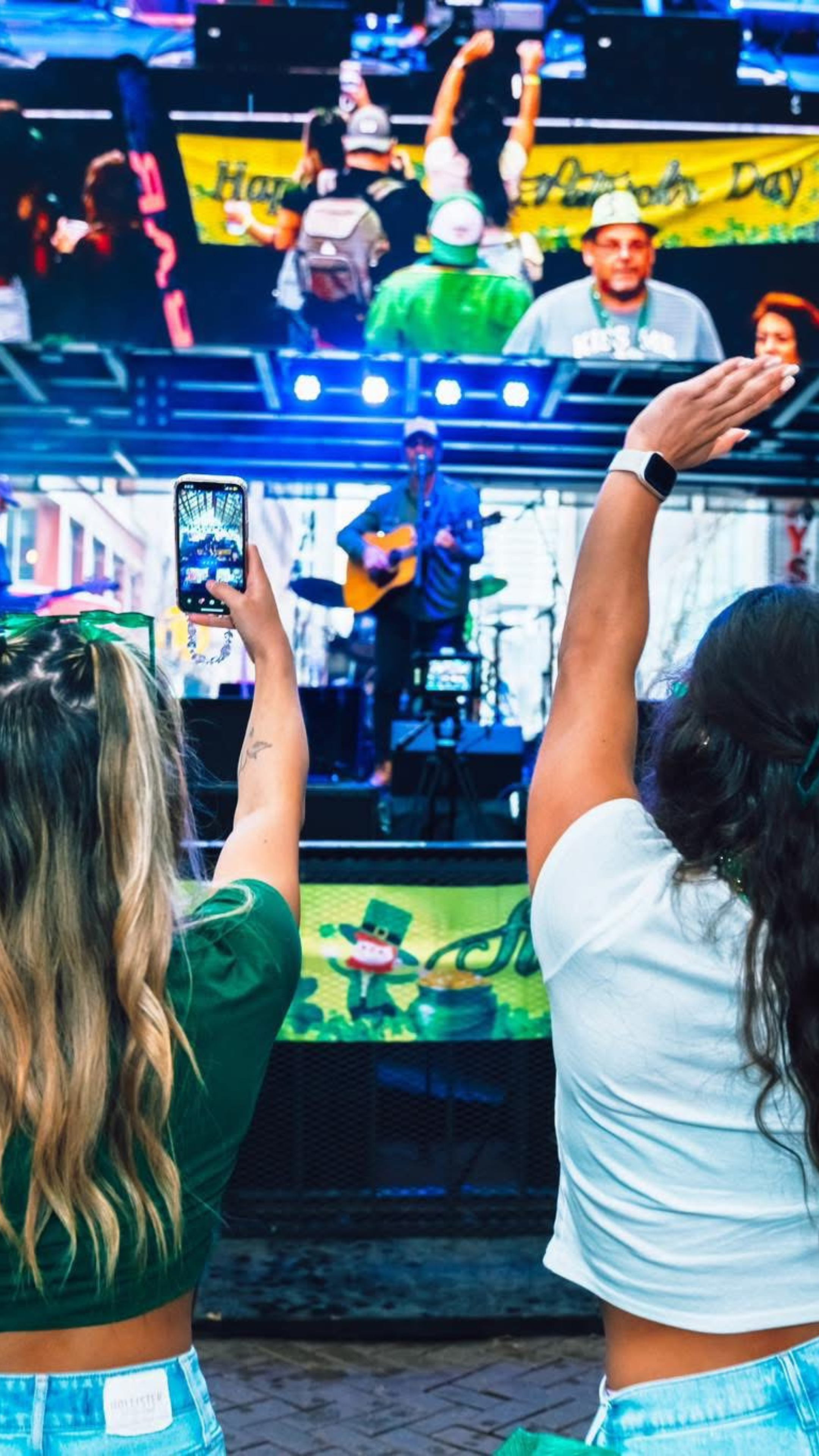 Two woman dancing to live music at Shamrocks and Shenanigans.