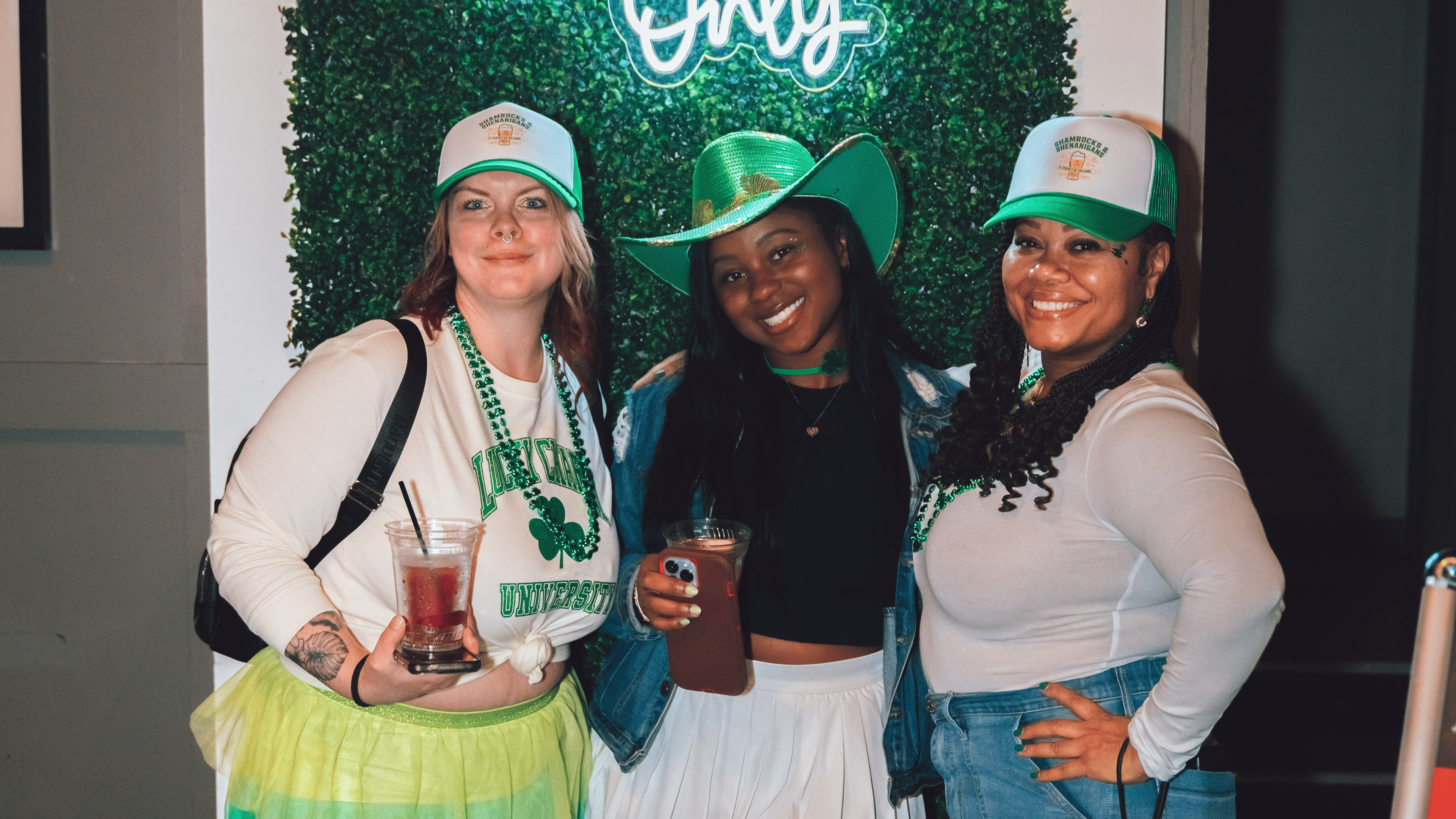 An image of 3 women at Shamrocks and Shenanigans posing for a pic.