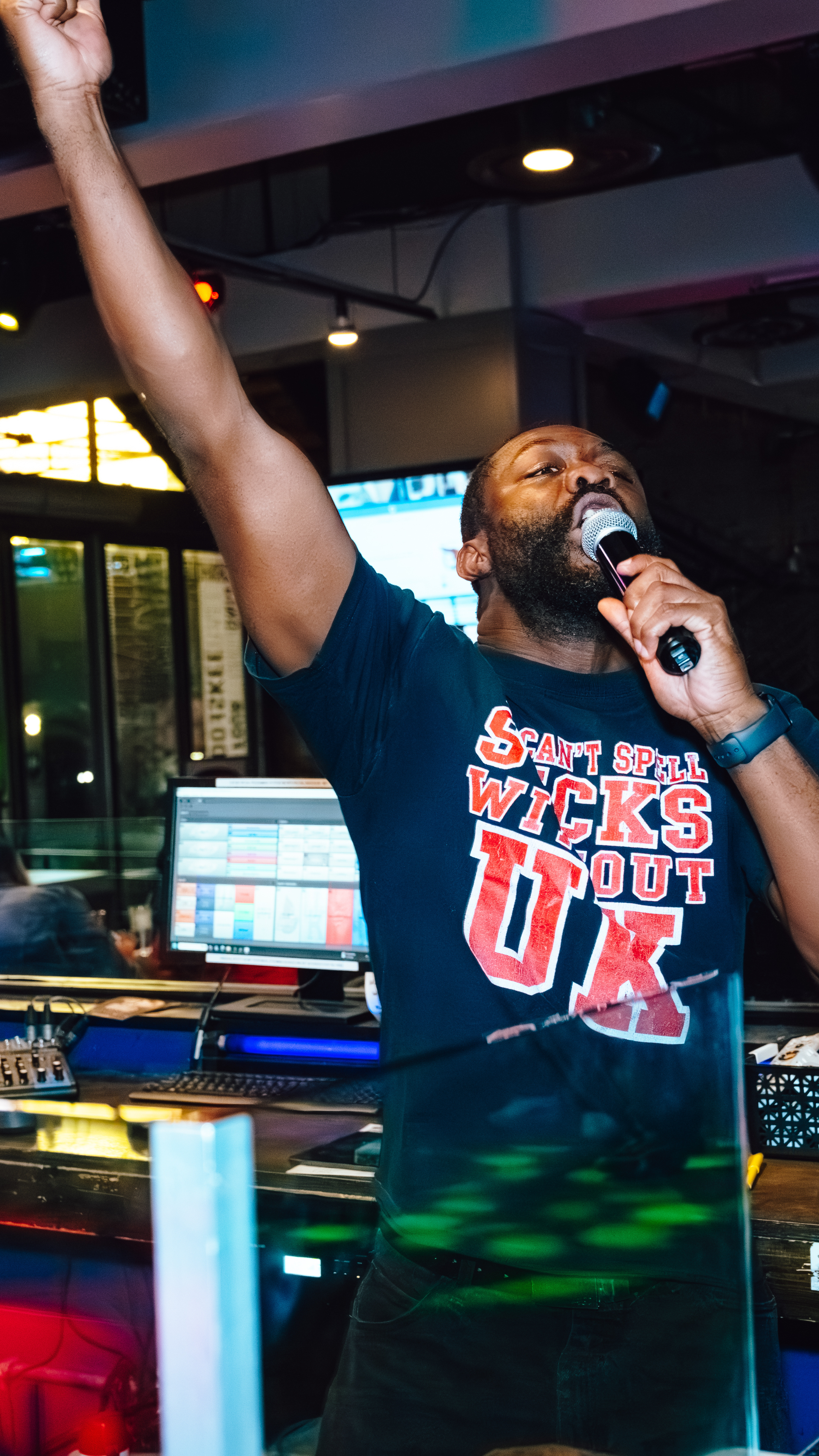 DJ Miles on the mic at Sports and Social.