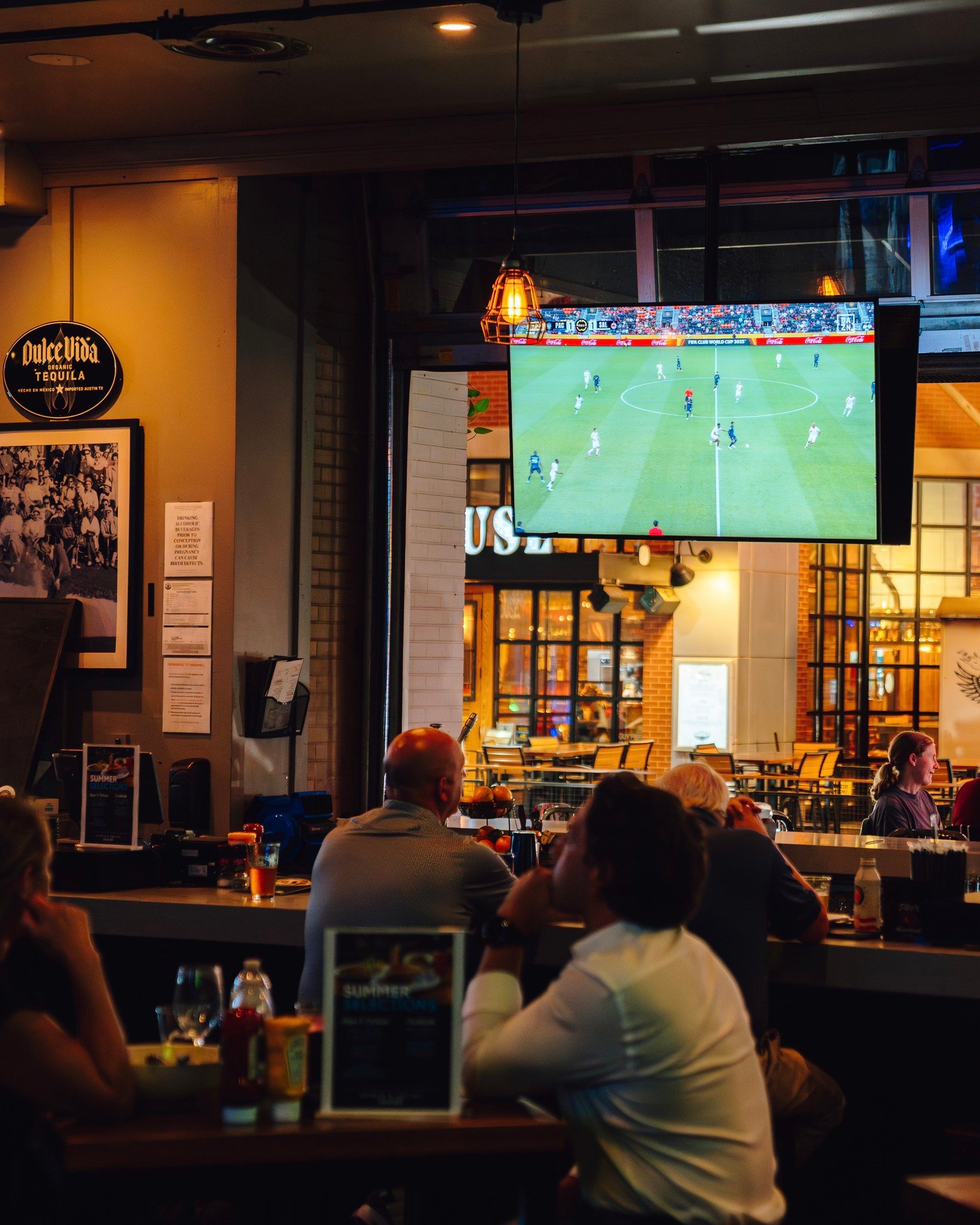 An image of soccer playing on the tbs at Sports and Social.