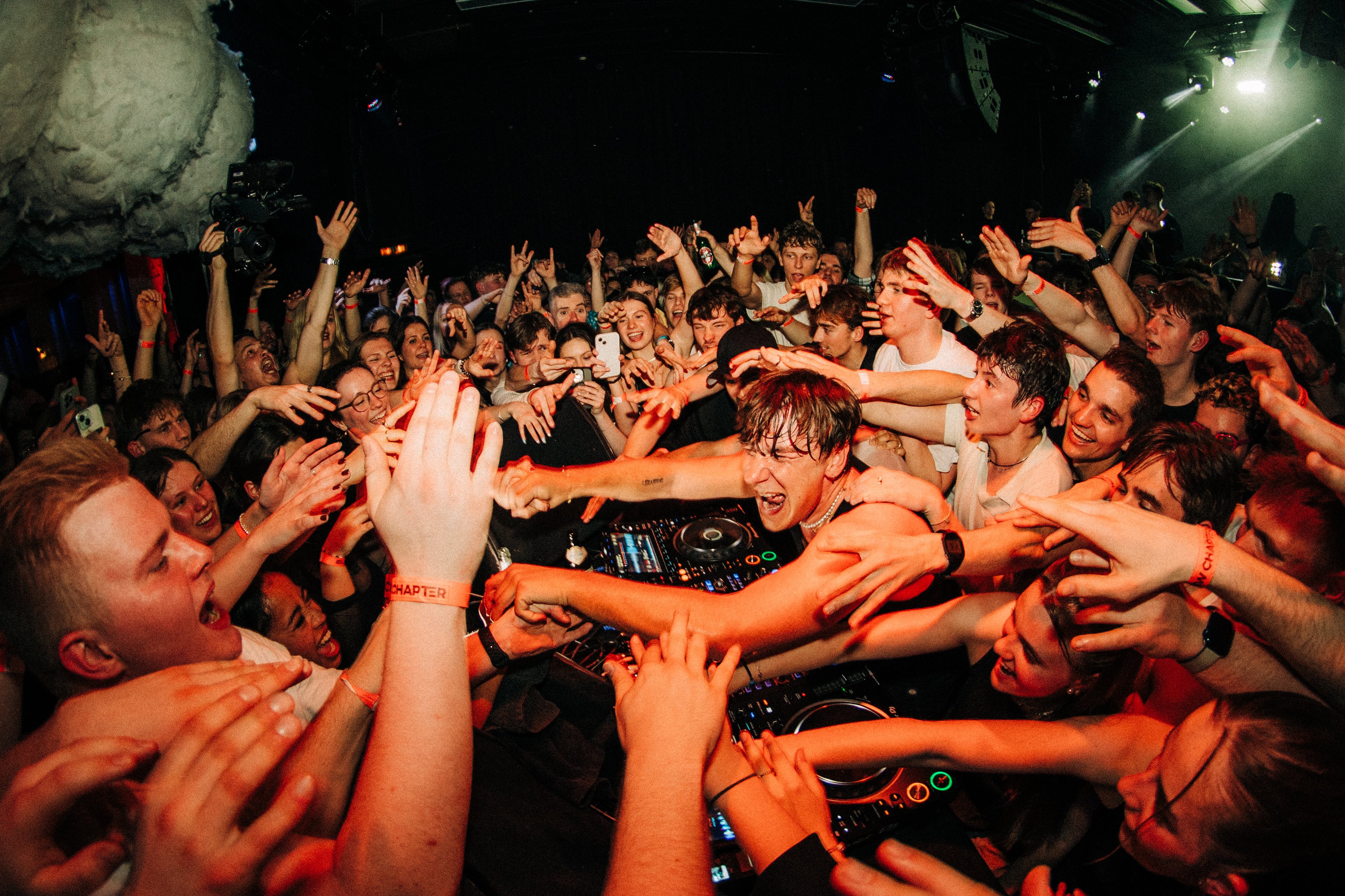 An image of fans grabbing BUNT.'s hands.