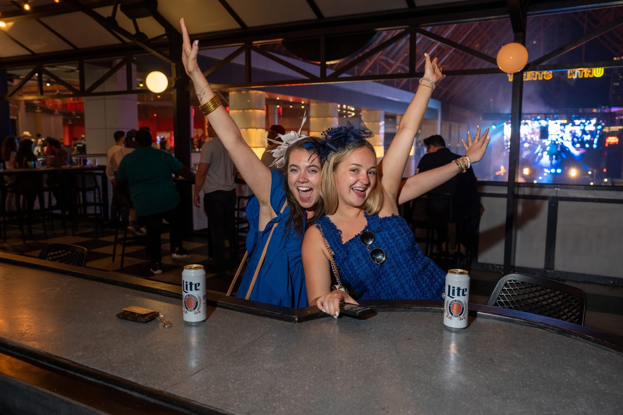 An image of two women on the PBR patio in Derby wear.