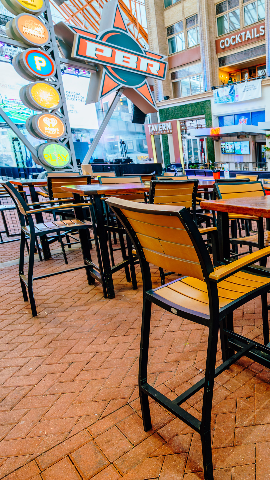 An image of the Guy Fieri's Smokehouse patio tables.