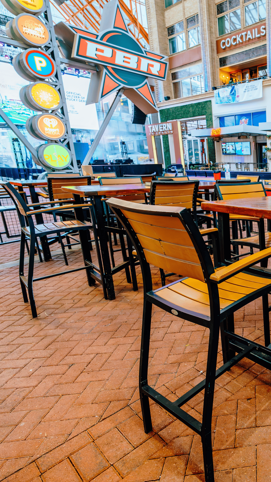 An image of the Guy Fieri's Smokehouse patio tables.