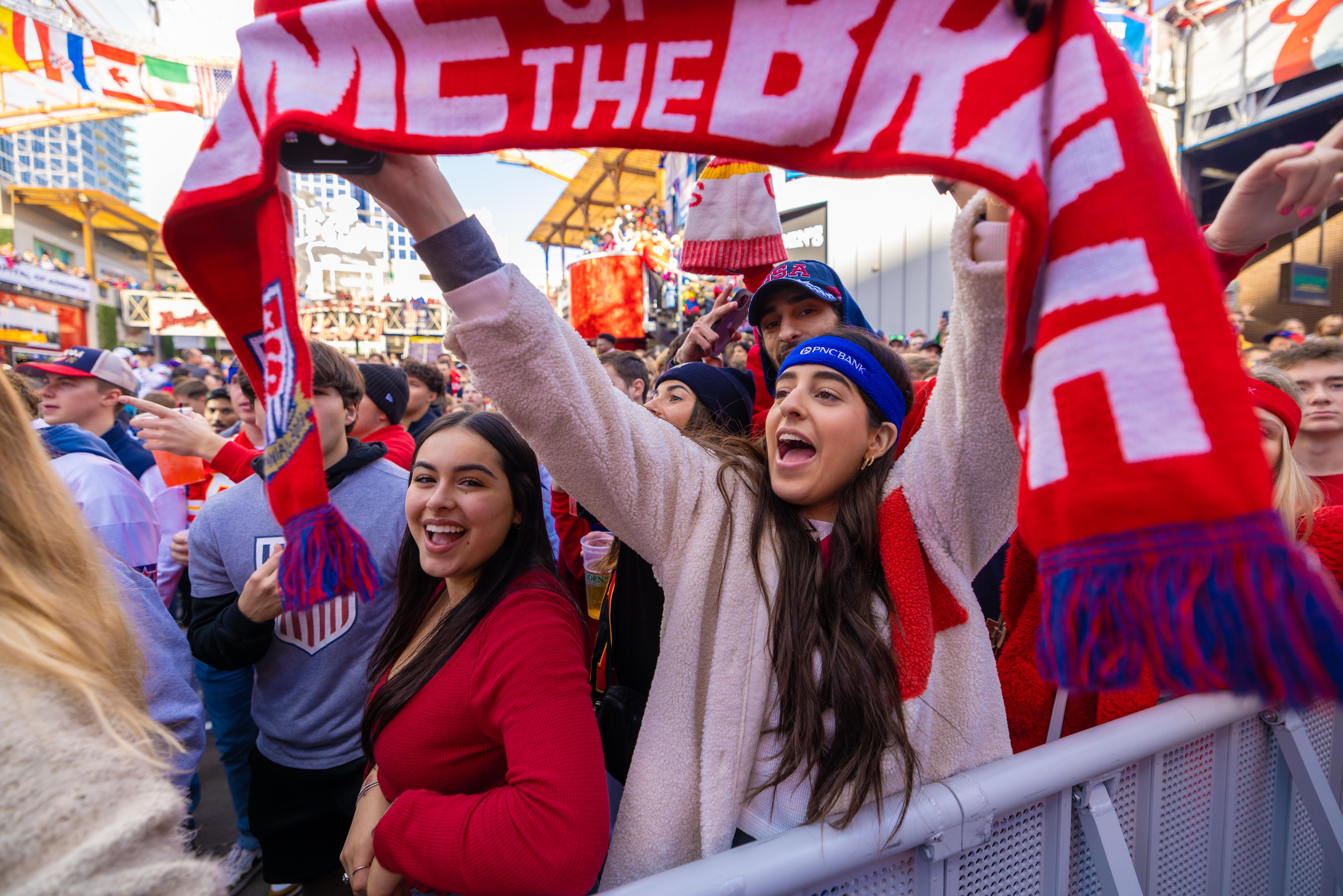 An image of USA fans holding up USA march.