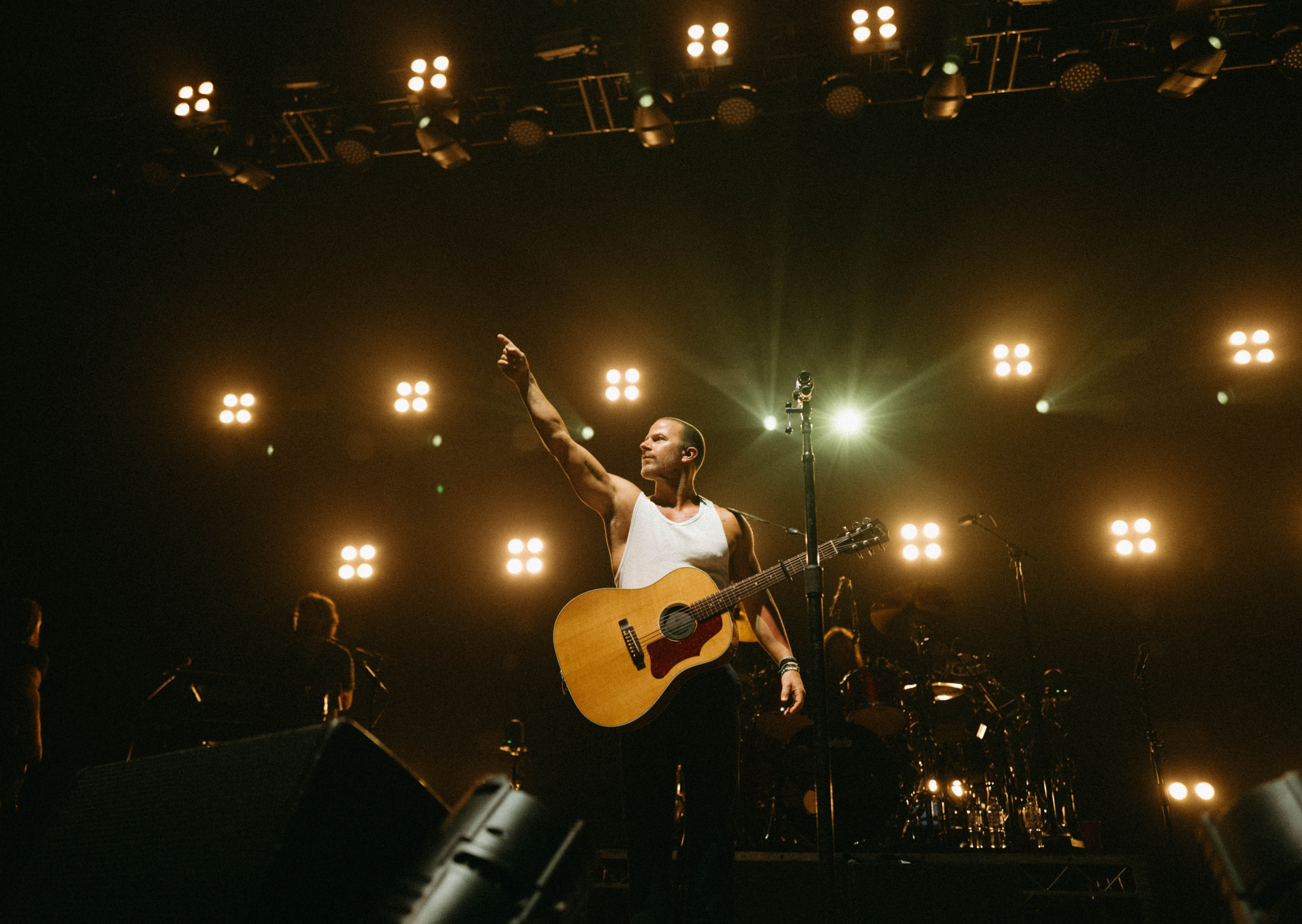 An image of Kip Moore performing on stage.