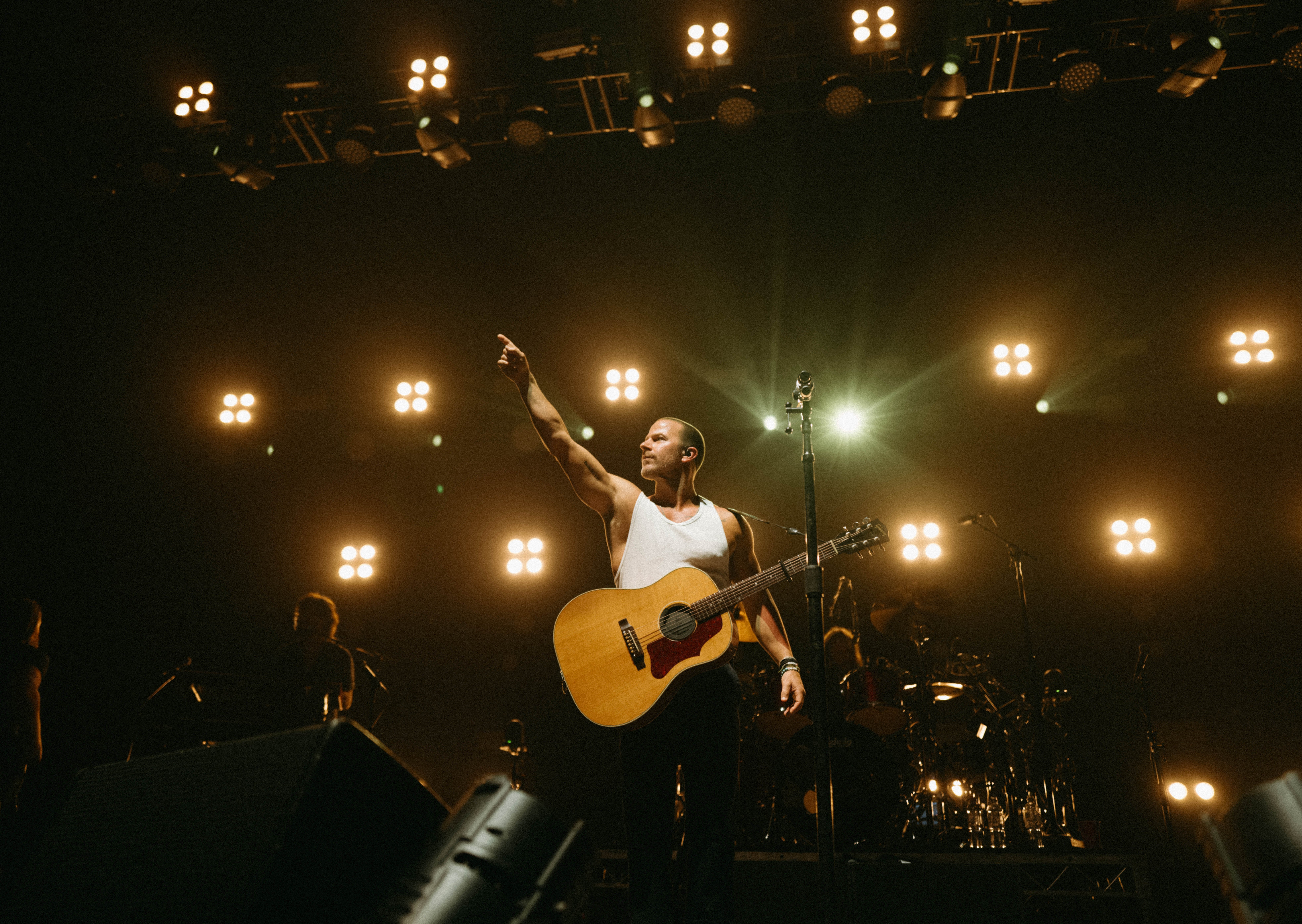 An image of Kip Moore performing on stage.