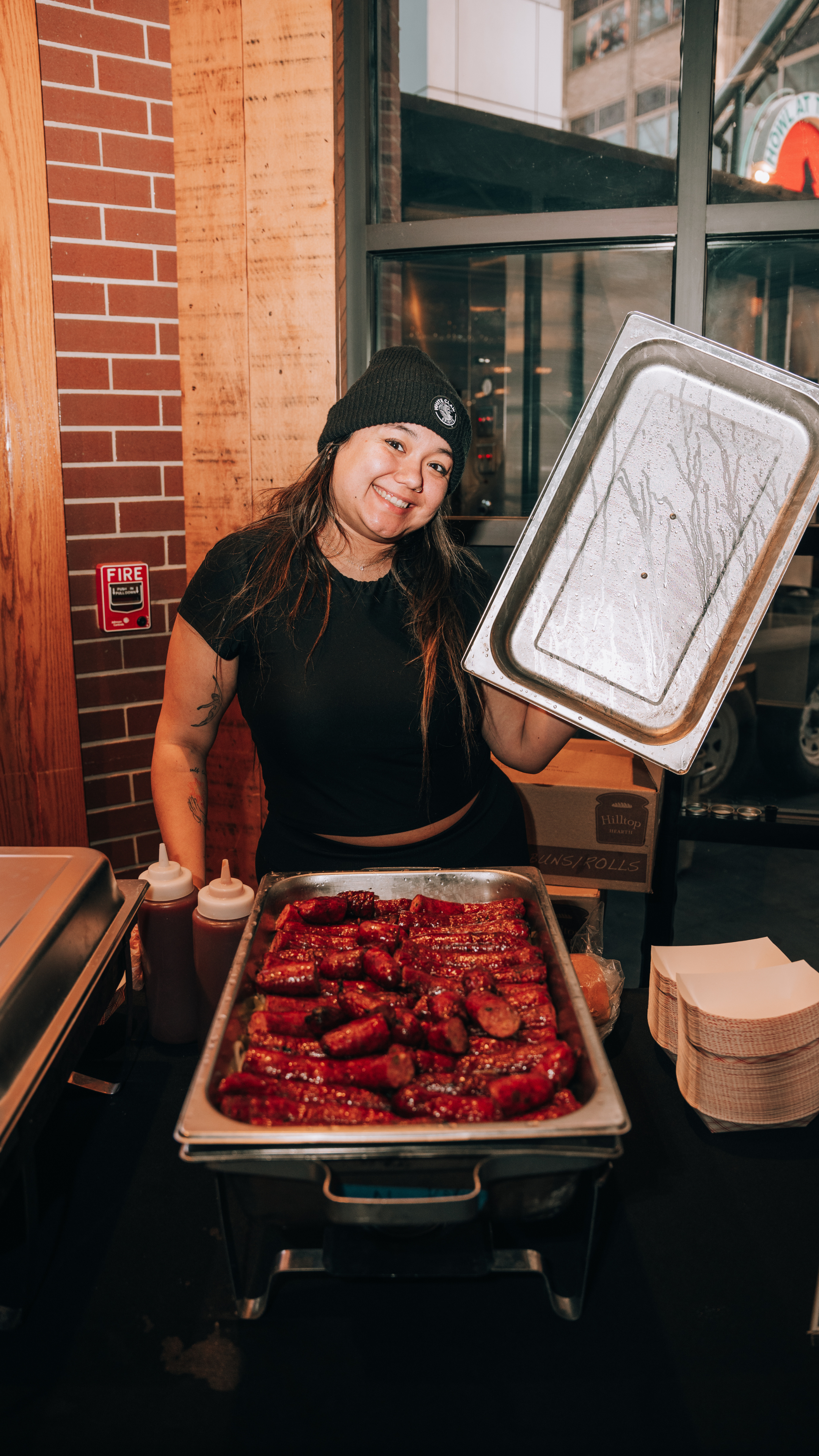 An image of a staff member showing off wings.