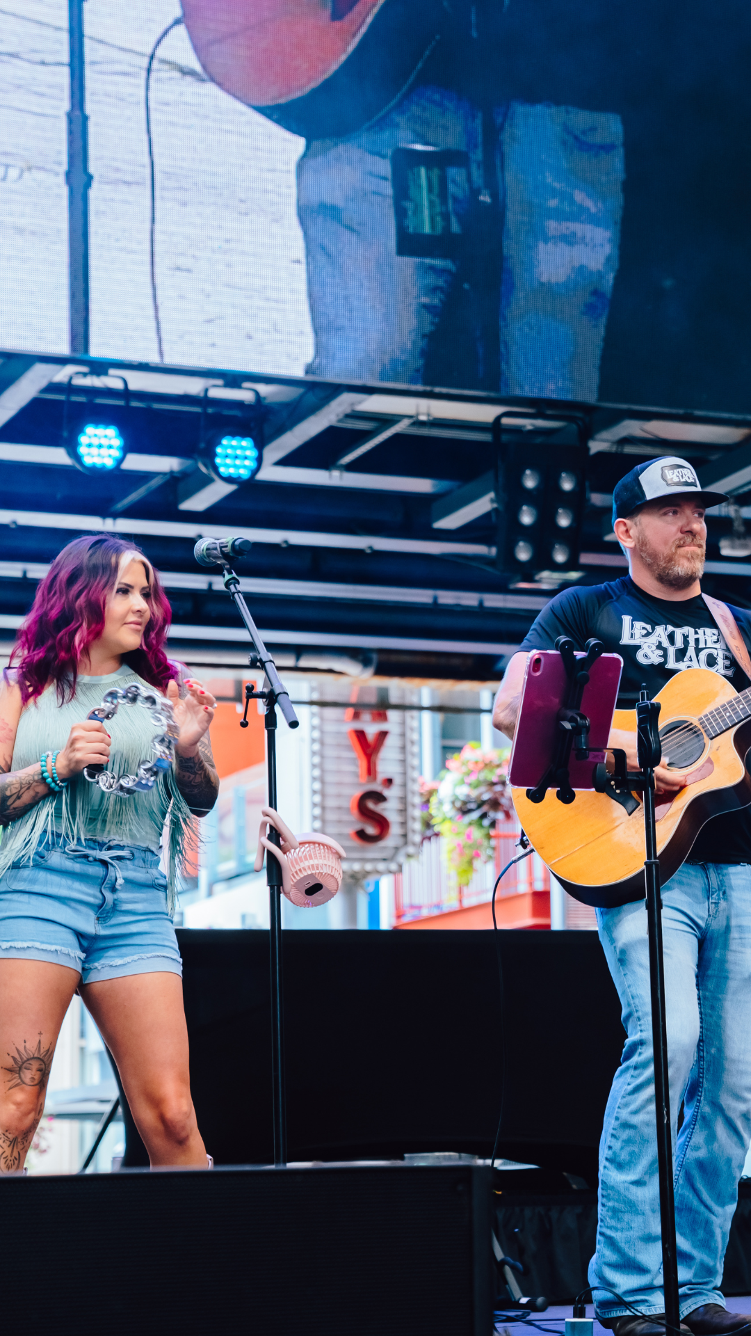 An image of a man and woman playing music at Wine Walk.