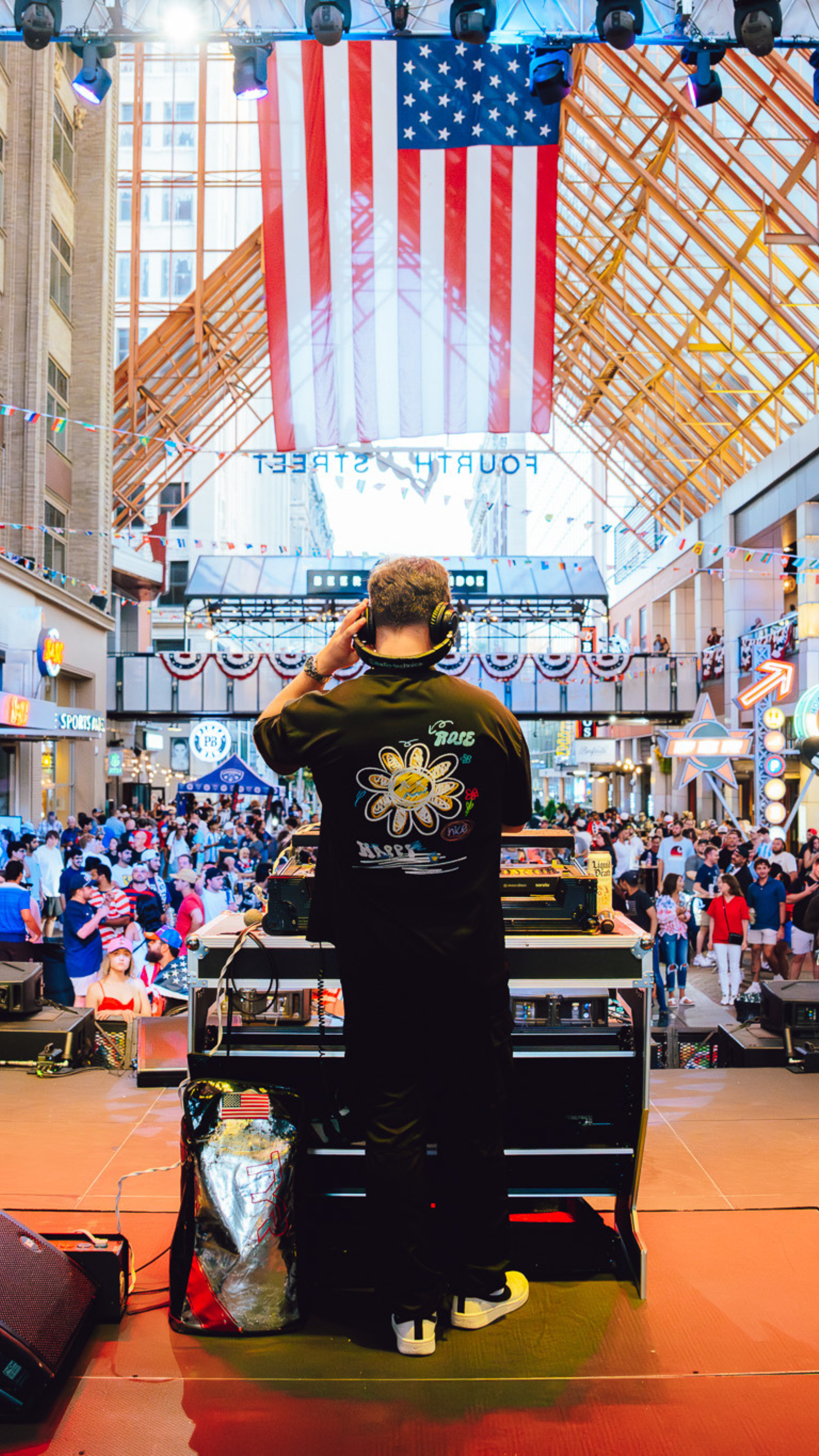 An image of a DJ playing for a crowd of soccer fans.