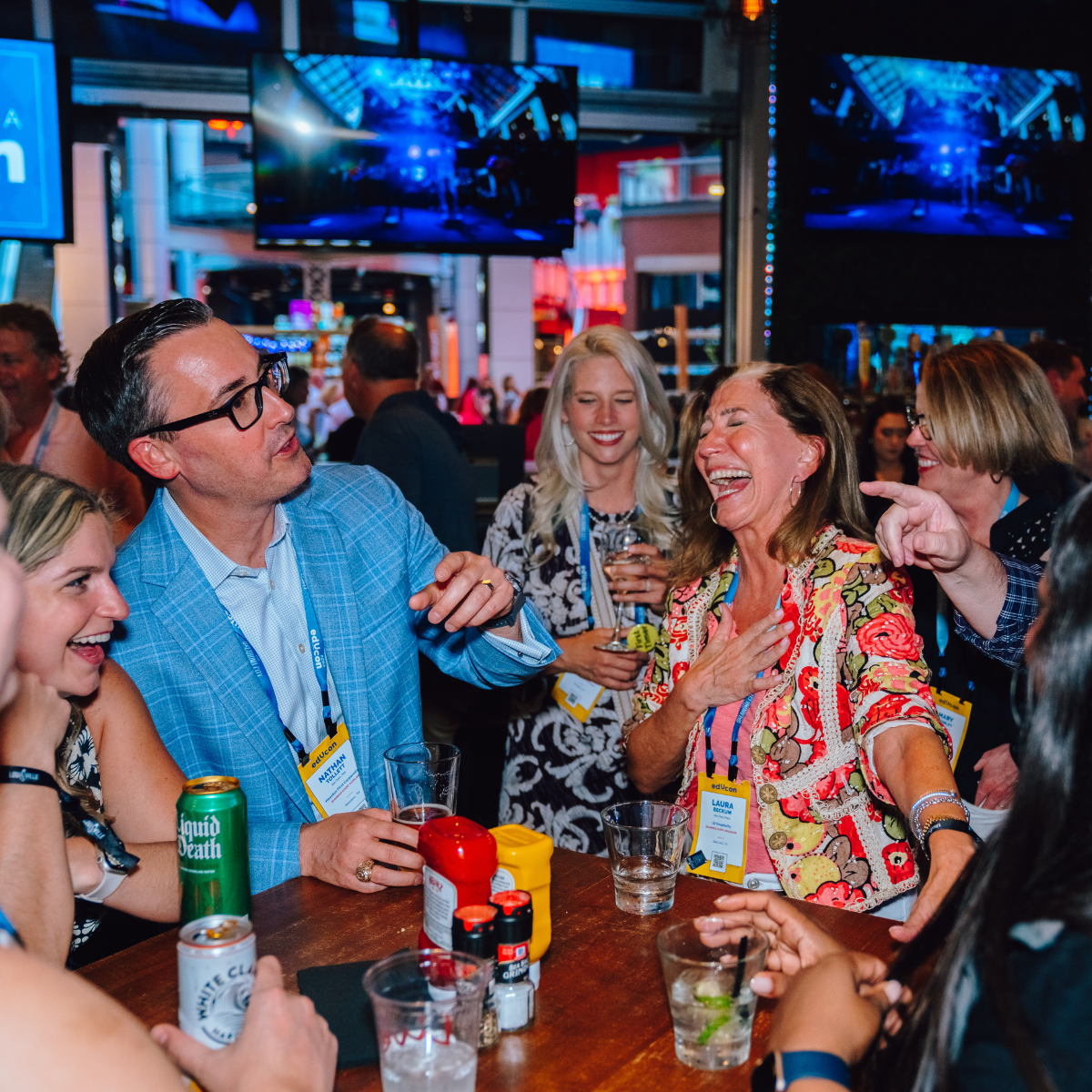 An image of people laughing at a private event at Sports and Social.
