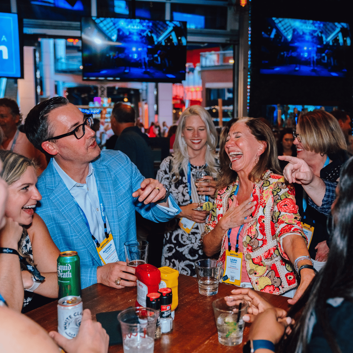 An image of people laughing at a private event at Sports and Social.