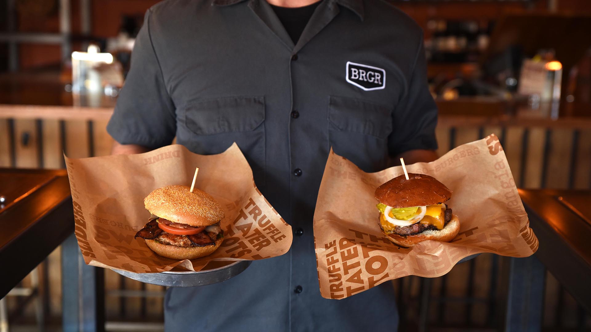 BRGR- Waiter holding 2 burgers