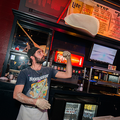 Pizza Bar - Man tossing pizza in the air