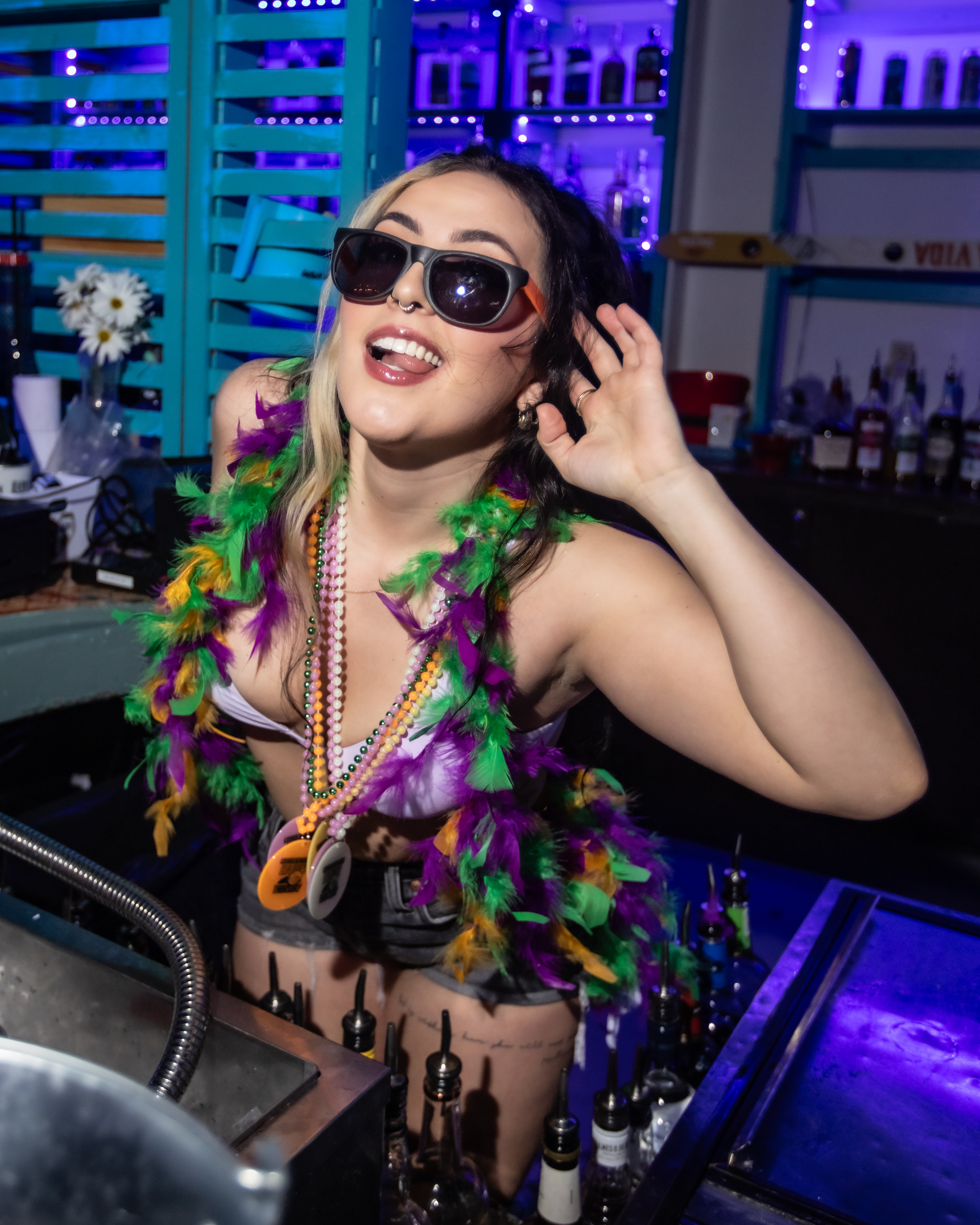 Shark Bar Bartender wearing Mardi Gras 