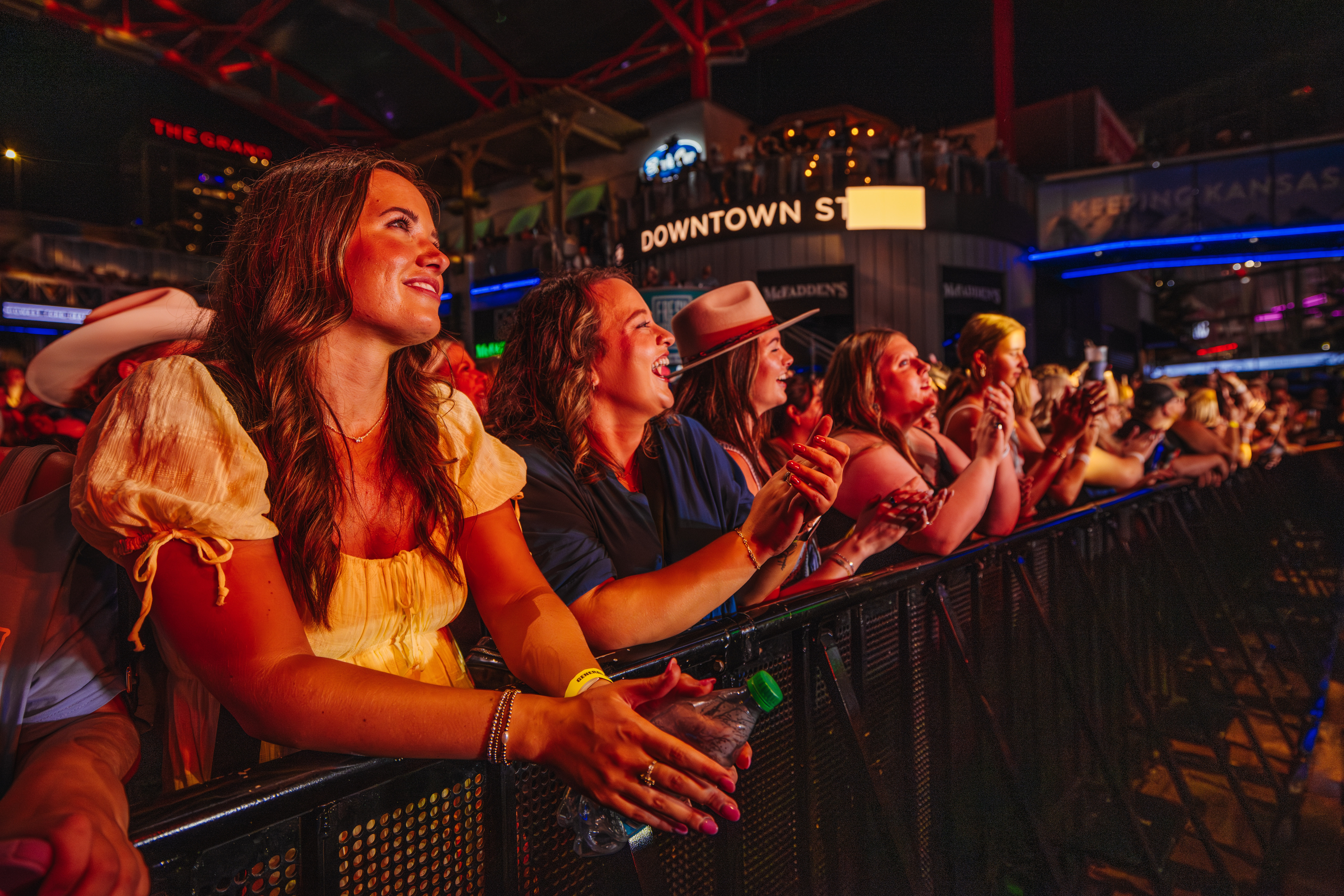 Fans smiling at barricade