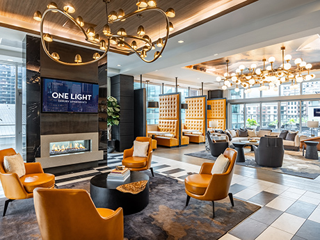 One Light Club Room and Coworking Lounge with open seating and fireplace.