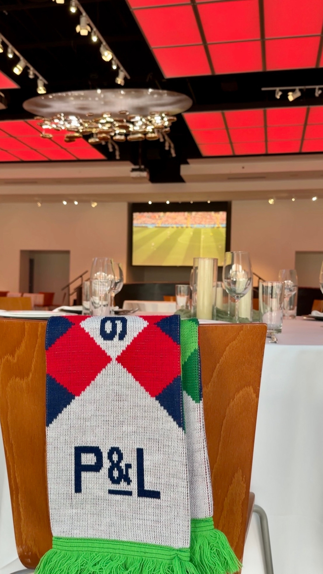 The Gallery Event Space set for Soccer in the City with a soccer scarf draped over a chair.