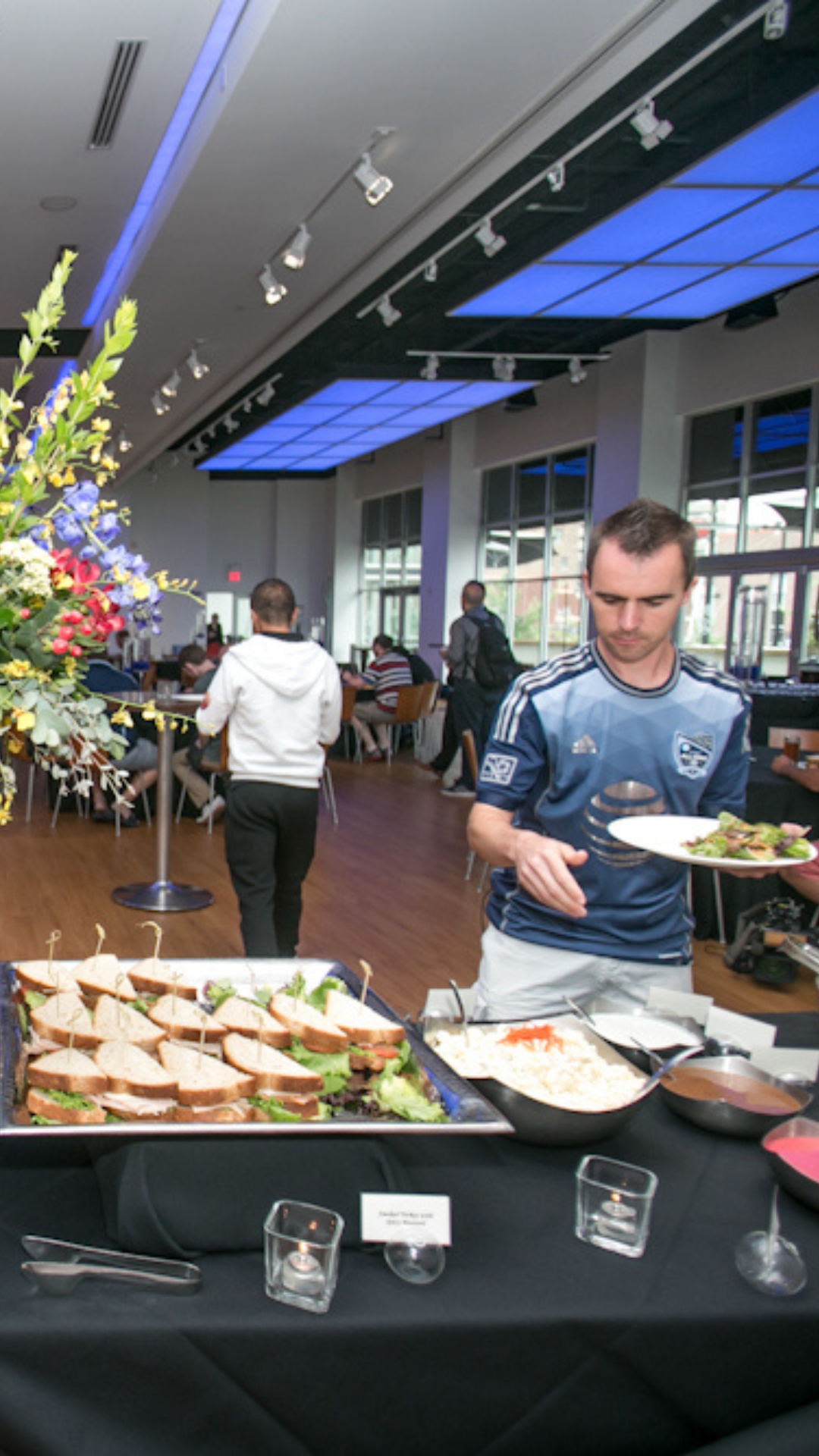 The Gallery Event Space catering set up with sandwiches and salad.